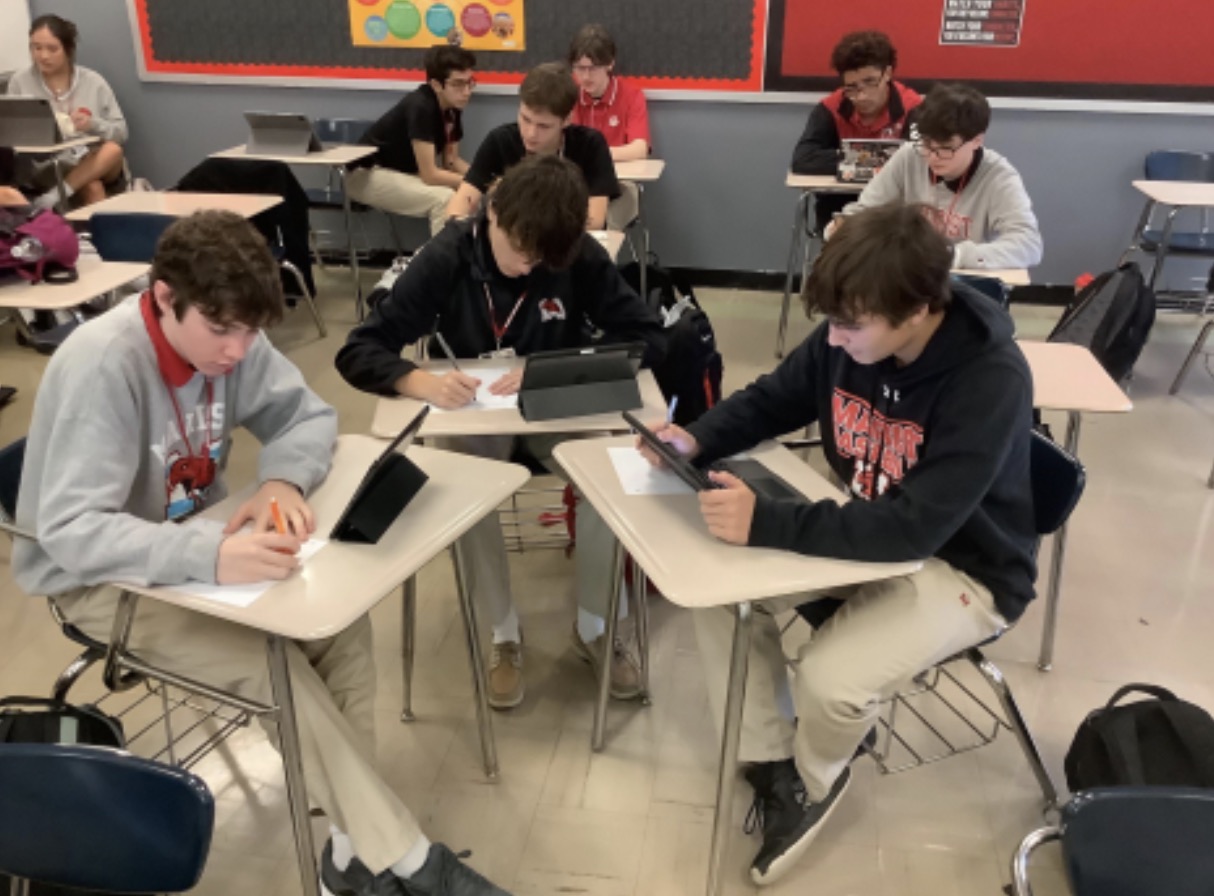 A group of AP Seminar students working together on a Project.
